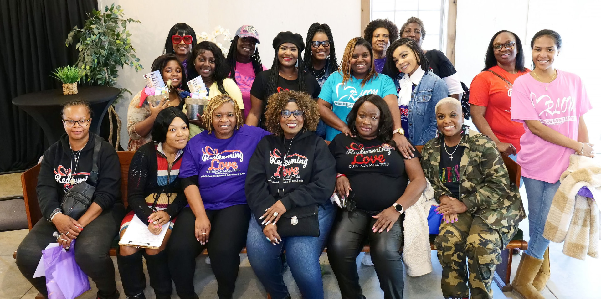 Large group portrait of the Daughters of Promise women's ministry after a gathering.